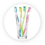 Denist accountant toothbrushes in a glass